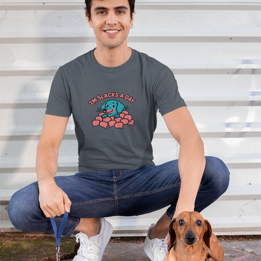 Man sitting on steps with a dachshund wearing a t-shirt with a graphic design.