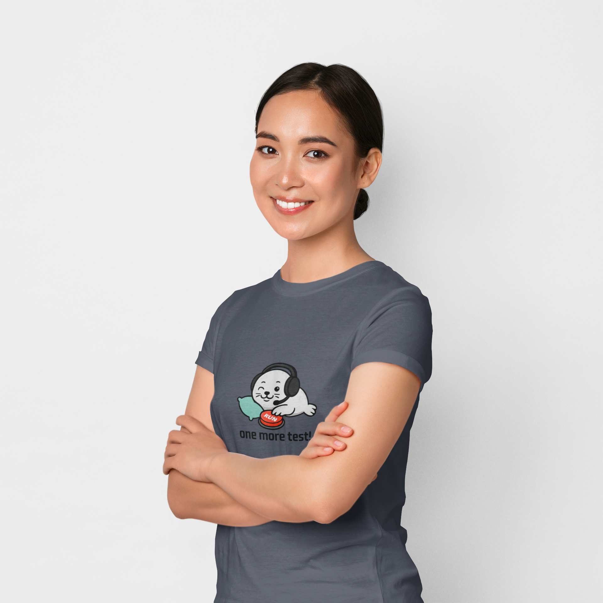 Woman wearing a gray t-shirt with a dog graphic and text on a white background