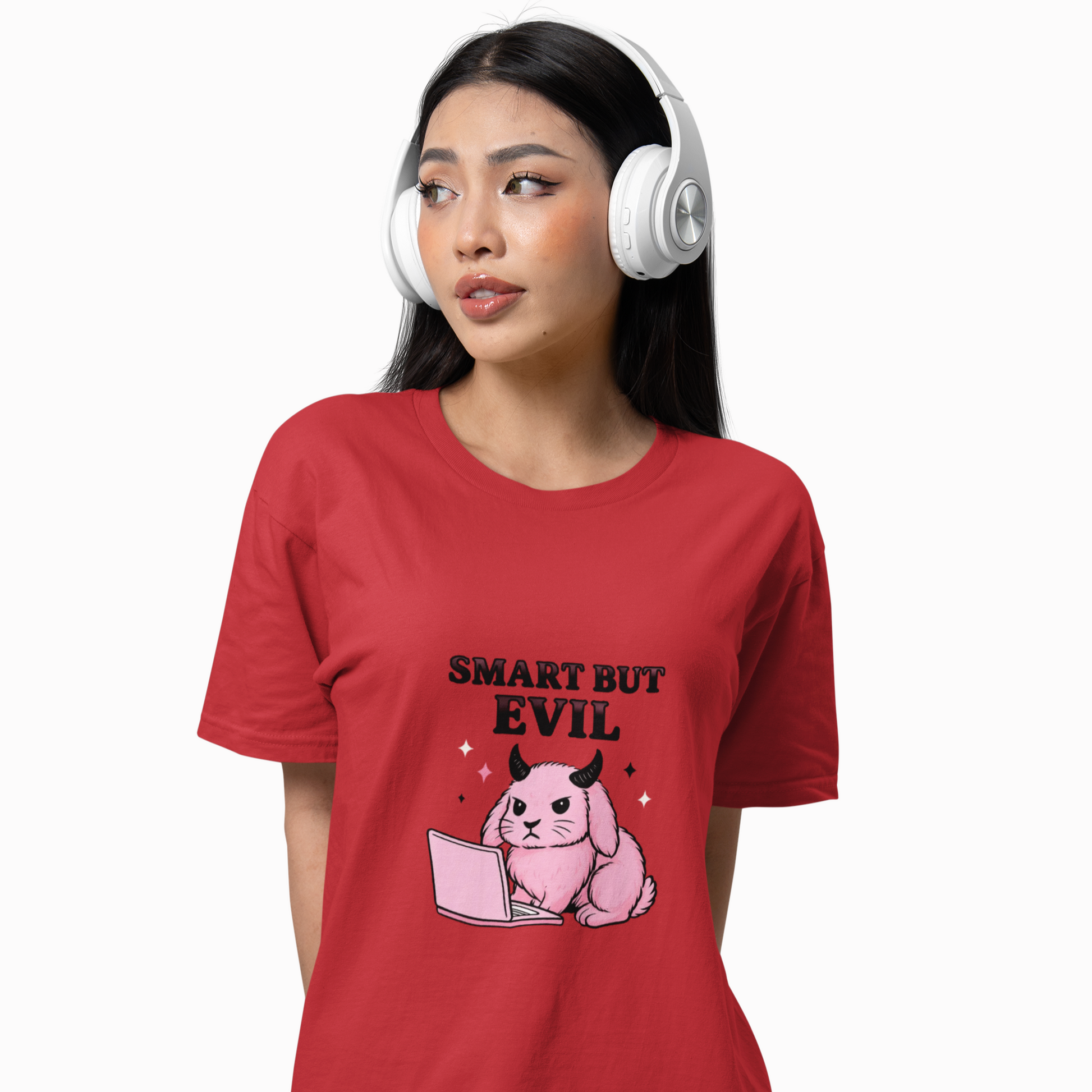 Person wearing a red t-shirt with a graphic design and text, headphones on, on a white background