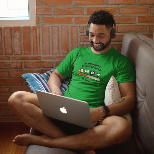 Man sitting on a couch using a laptop with a brick wall background