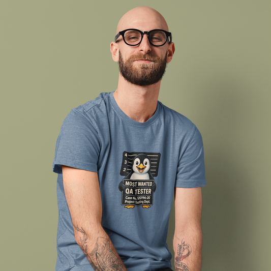 Man wearing a blue t-shirt with a graphic design on a green background