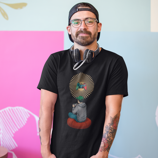 Man wearing a black t-shirt with a graphic design, standing against a colorful wall.