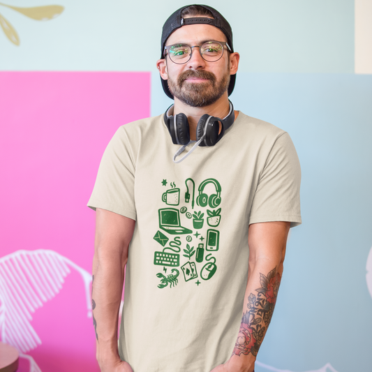 Man wearing a beige t-shirt with green graphics and headphones, standing against a colorful wall.