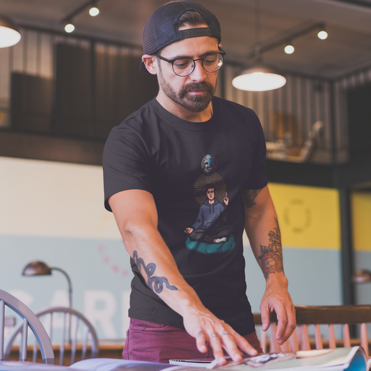 Man wearing a black t-shirt with a graphic design, standing in an indoor setting.