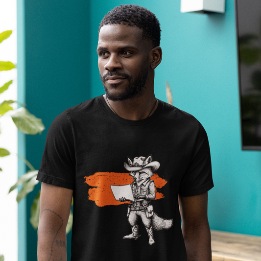 Man wearing a black t-shirt with a graphic design in front of a teal wall.