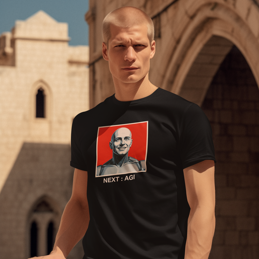 Man wearing a black t-shirt with a graphic design in front of an architectural background