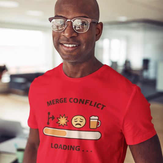 Man wearing a red t-shirt with a humorous graphic design in an office setting