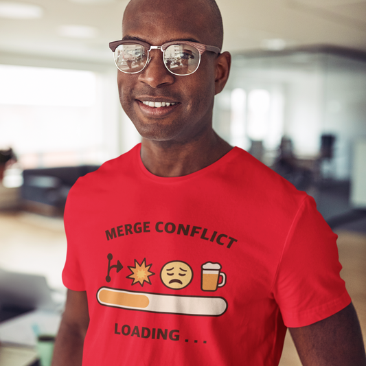 Man wearing a red t-shirt with a humorous graphic design in an office setting