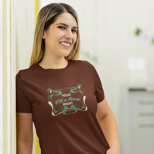Woman wearing a brown t-shirt with a graphic design and text.