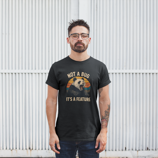 Man wearing a black t-shirt with a panda graphic and text against a white corrugated metal background