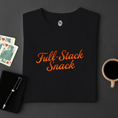 Black t-shirt with 'Full-Stack Snack' text on a dark surface with cards and a cup.