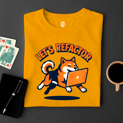 Yellow t-shirt with a dog graphic and 'Let's Refactor' text on a dark surface with cards and a mug.
