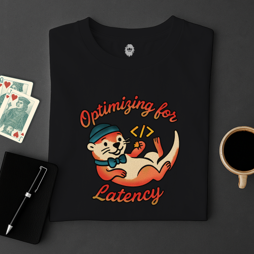 Black t-shirt with a graphic of an otter and text 'Optimizing for Latency' on a dark surface with cards and a cup.