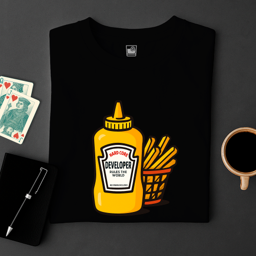 Black t-shirt with a yellow mustard bottle graphic on a dark surface with coffee, cards, and a pen.