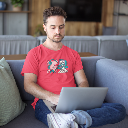 Man using a laptop on a couch in a living room