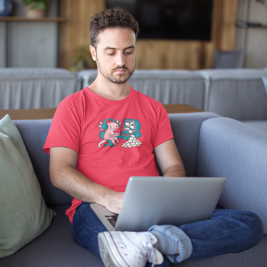 Man using a laptop on a couch in a living room