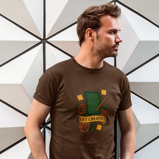 Man wearing a brown t-shirt with a graphic design and text, standing against a geometric-patterned wall.