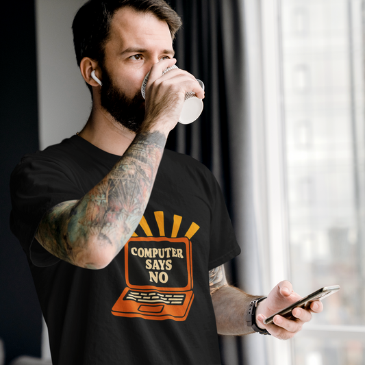 Man drinking from a cup while holding a phone, wearing a black t-shirt with a graphic design.